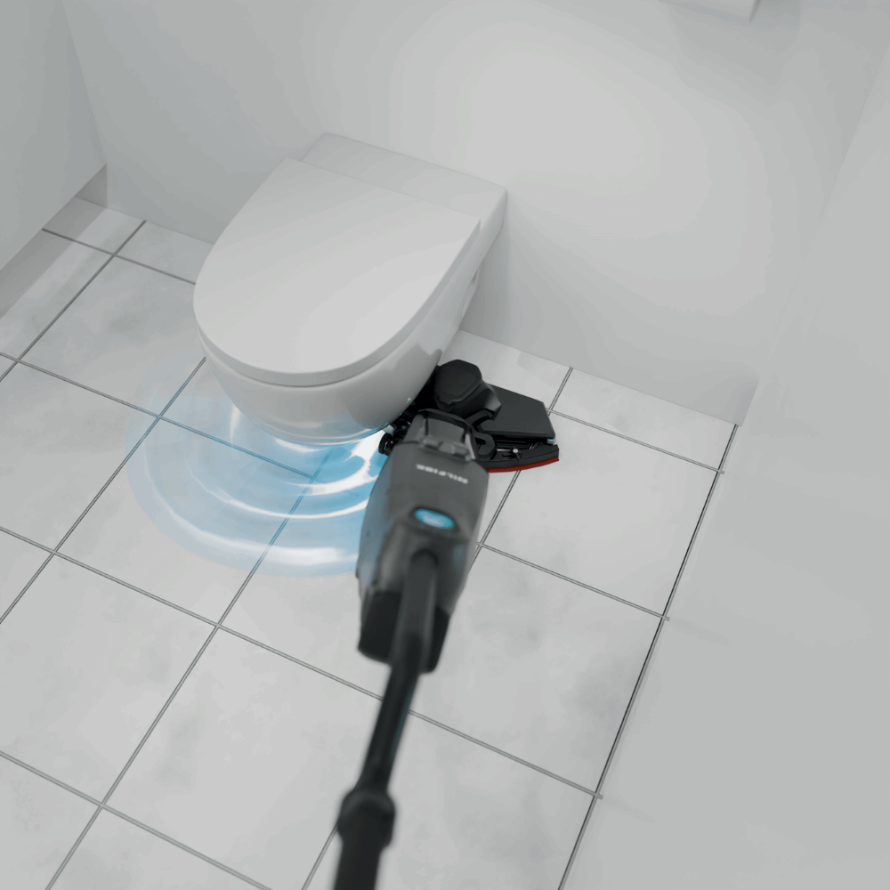 Nilfisk DRYFT Compact Floor Scrubber Dryer efficiently cleans around toilets and cubicles in commercial spaces.