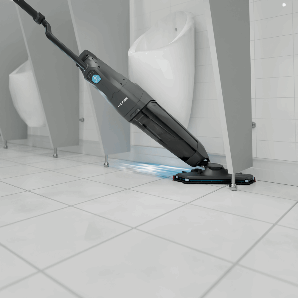 Nilfisk DRYFT Compact Floor Scrubber Dryer designed for cleaning toilet areas, cubicles, and tight spaces efficiently.