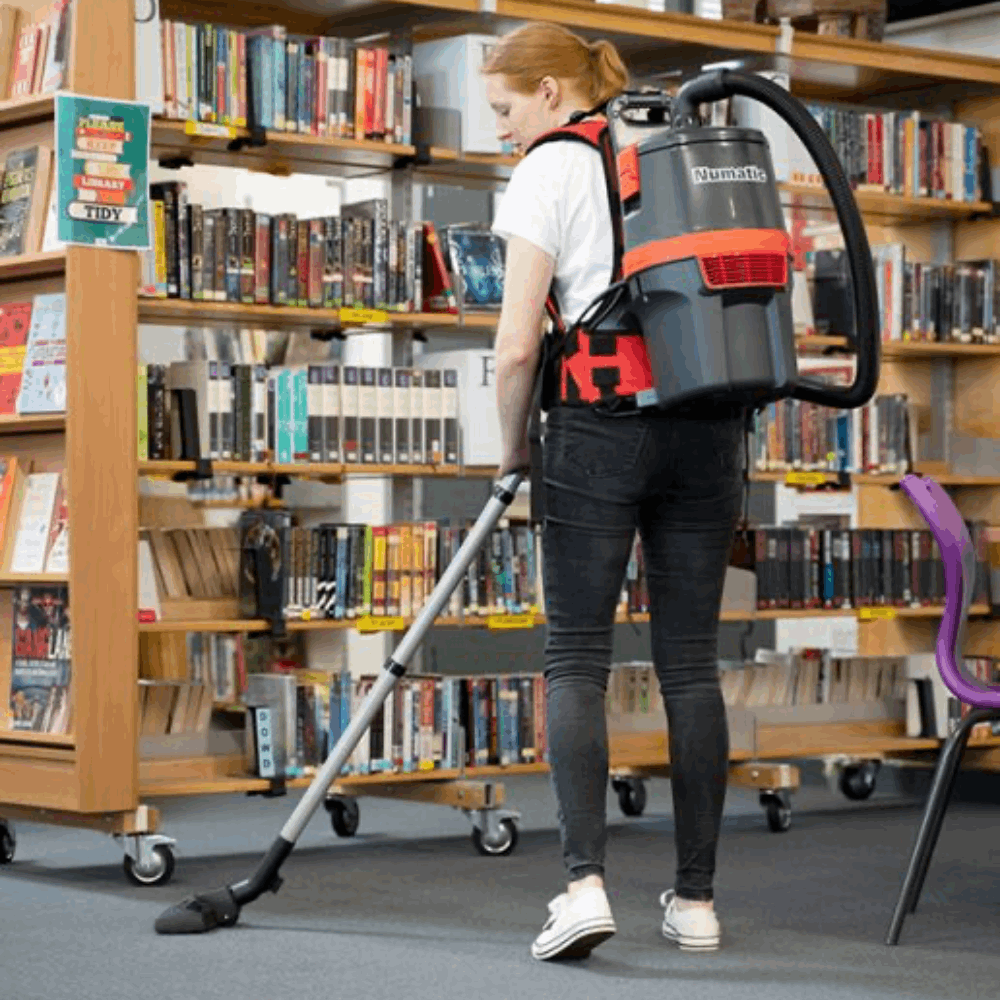 Numatic RSB 150NX-H backpack vacuum, ideal for tight spaces like theaters and airplanes, offers cordless convenience.