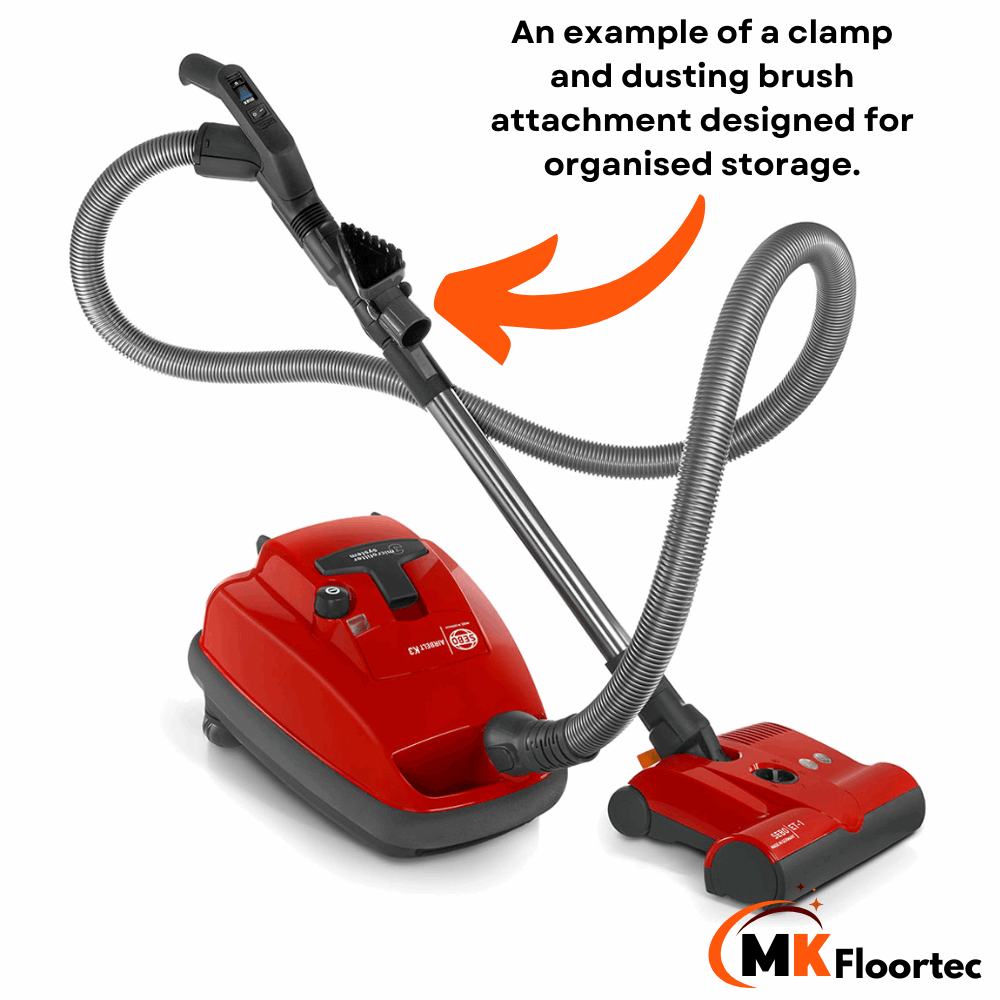 Tool attachment clamp with dusting brush, part 6697ER, designed for Sebo Airbelt D, E, & K cylinder vacuums.