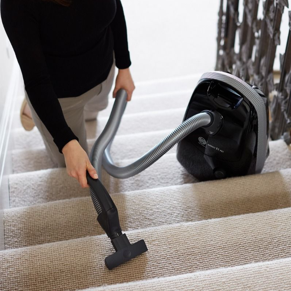 Sebo Airbelt E1 Pet +BOOST vacuum cleaner designed for effective pet hair removal with turbo tools and brush.