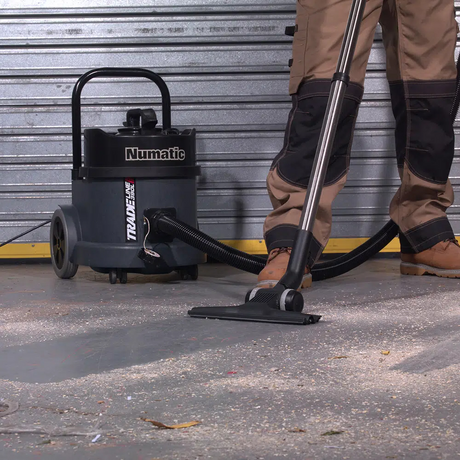  Numatic Tradeline TEL390S vacuum with HEPA H13 filter and various tools for efficient dust management in trade and construction.