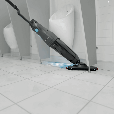 Nilfisk DRYFT Compact Floor Scrubber Dryer designed for cleaning toilet areas, cubicles, and tight spaces efficiently.  