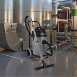 Industrial-grade Numatic NTD750-2 vacuum cleaner with trolley and dual motors, ideal for daily cleaning in workshops and factories.