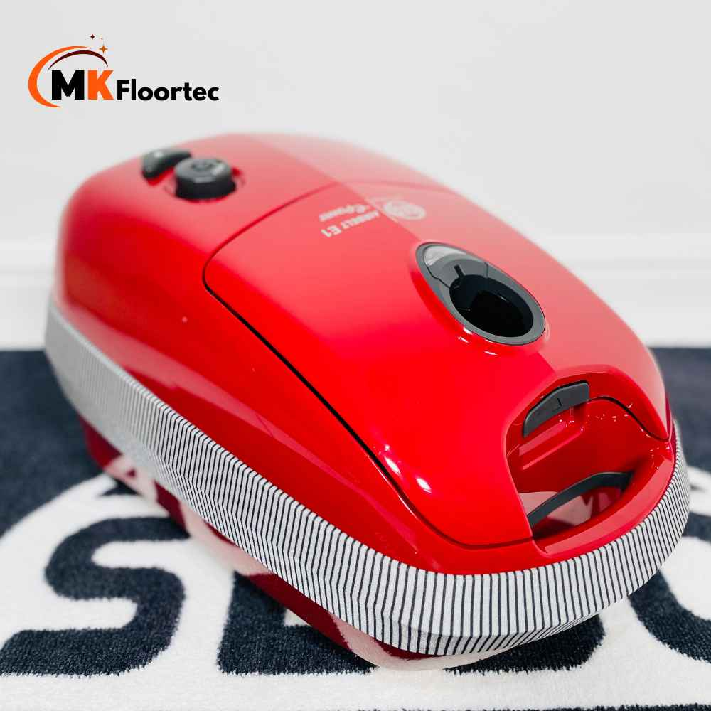 Powerful Sebo E1 Red +BOOST vacuum with 1200W, 3.5L bag capacity, and excellent filtration for efficient cleaning.